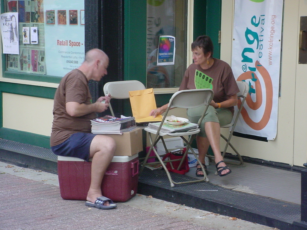 Two KC Fringe volunteers working.