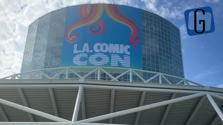 The outside of the Los Angeles Convention Center - a tower of glass windows - with a banner for LA Comic Con with tentacles coming down it.