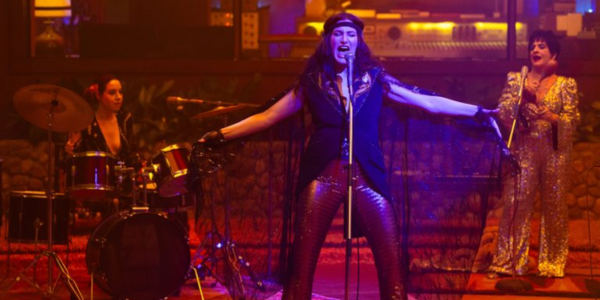 Aubrey Plaza on drums, Patti LuPone on backup, and Kathryn Hahn as lead singer in a glam style band.