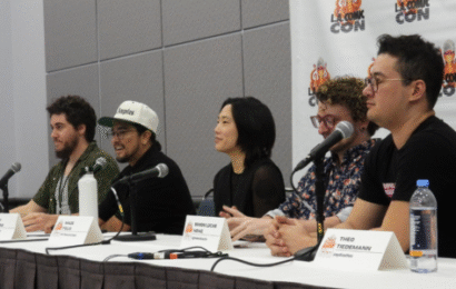 five people sitting behind a table at LA Comic Con