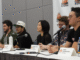 five people sitting behind a table at LA Comic Con
