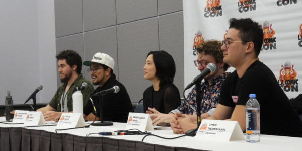 five people sitting behind a table at LA Comic Con