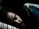 Kenneth Trujillo (as Richard) asleep as a grim hand grabs him.
