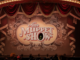 A theatre marquee with The Muppet Show on a screen in the middle.. Kermit is in the O.