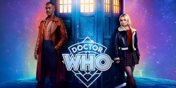 a black man in a brown jacket, blue pants, and a striped shirt stands left of a blue telephone box, while a young white woman in a blue jacket, red shirt, and plaid skirt stands on the right.