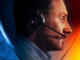 the top half of the poster for Lifeline: a white man facing right wearing a phone headset is in the upper half of a hourglass